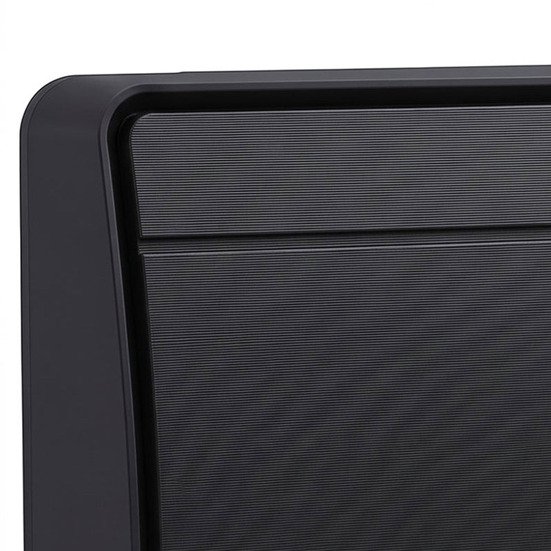 Close-up of the black heater's textured front grille and housing corner