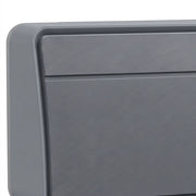 Close-up of the grey heater's textured front grille and housing corner