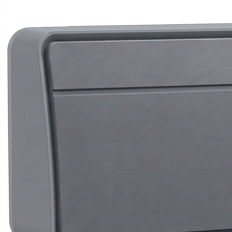 Close-up of the grey heater's textured front grille and housing corner