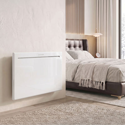 1000W white panel heater wall-mounted beside a bed