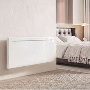 2000W white panel heater wall-mounted beside a bed