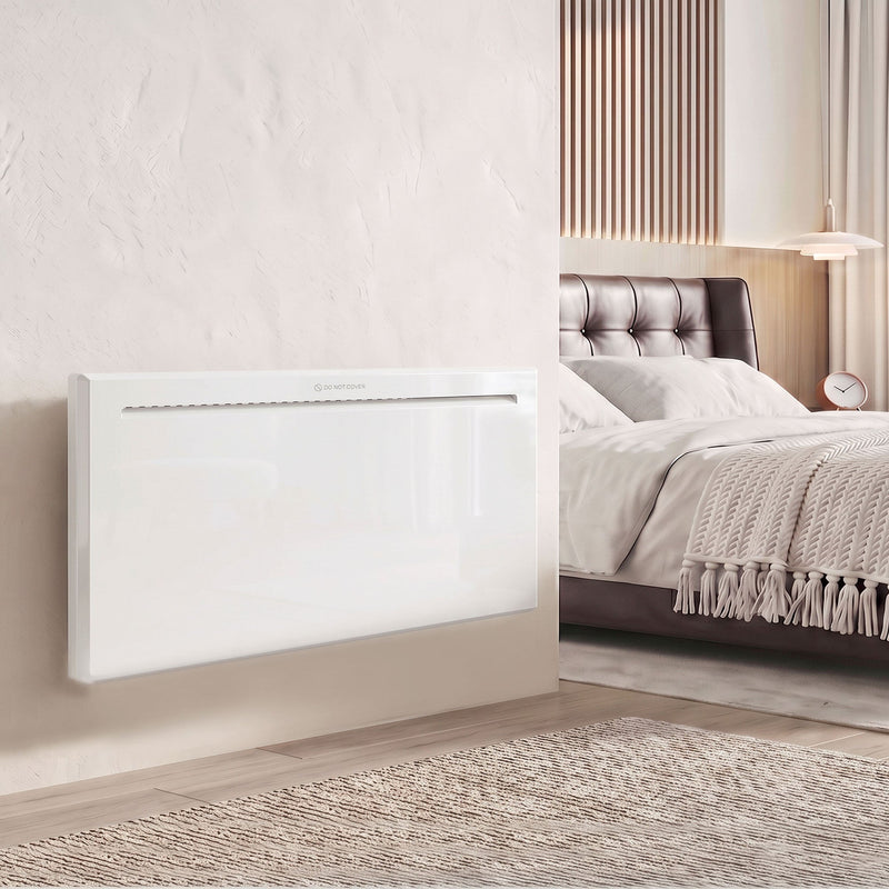 2000W white panel heater wall-mounted beside a bed