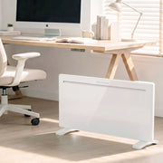 White panel heater on standing feet in a bright room