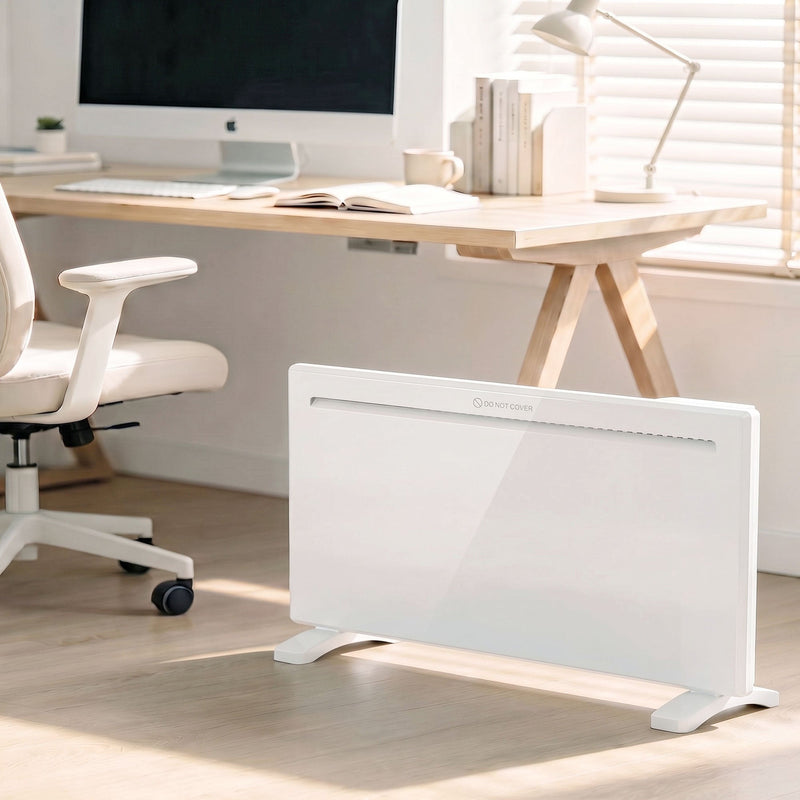 White panel heater on standing feet in a bright room