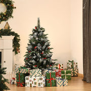 4ft snow dipped Christmas tree in a living room beside a fireplace and wrapped gifts