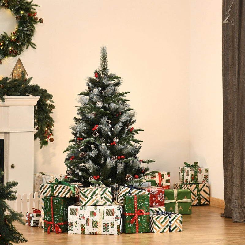 4ft snow dipped Christmas tree in a living room beside a fireplace and wrapped gifts
