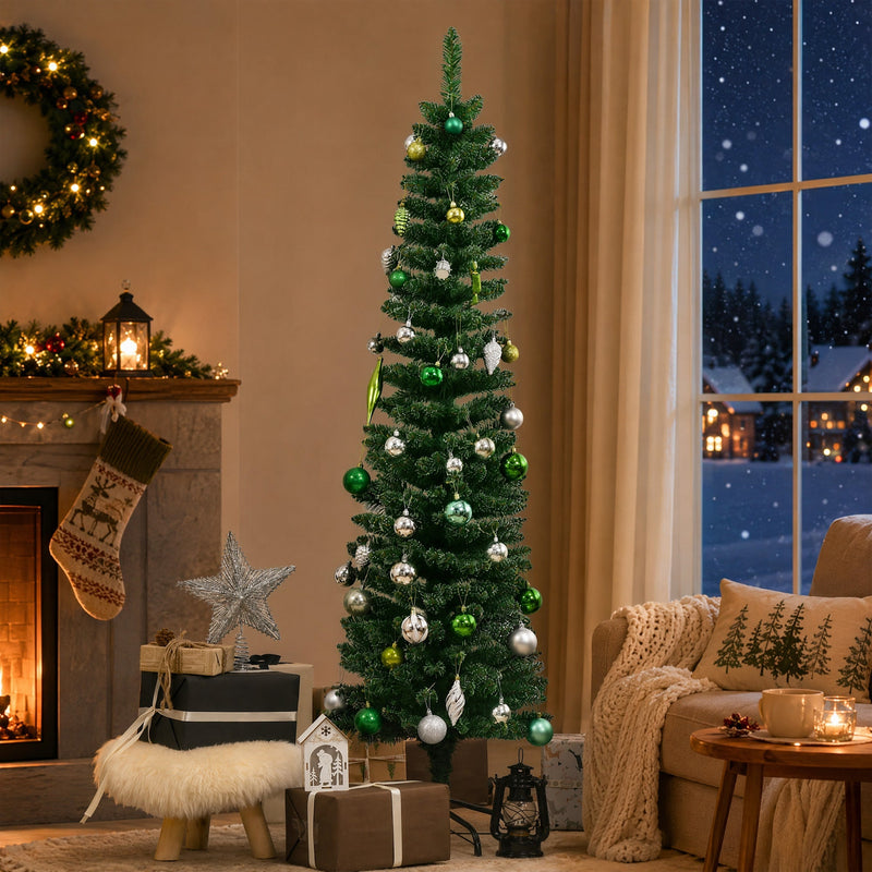 Decorated snow-dipped tree with baubles and a star beside a fireplace and snowy window