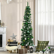 Snow-dipped pencil Christmas tree with green and silver baubles beside a white fireplace