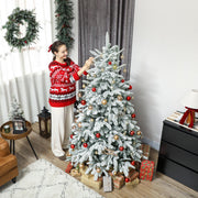 Woman in a red jumper adding baubles to the 6ft snow flocked tree