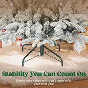 Dark green foldable metal base under the snow flocked branches