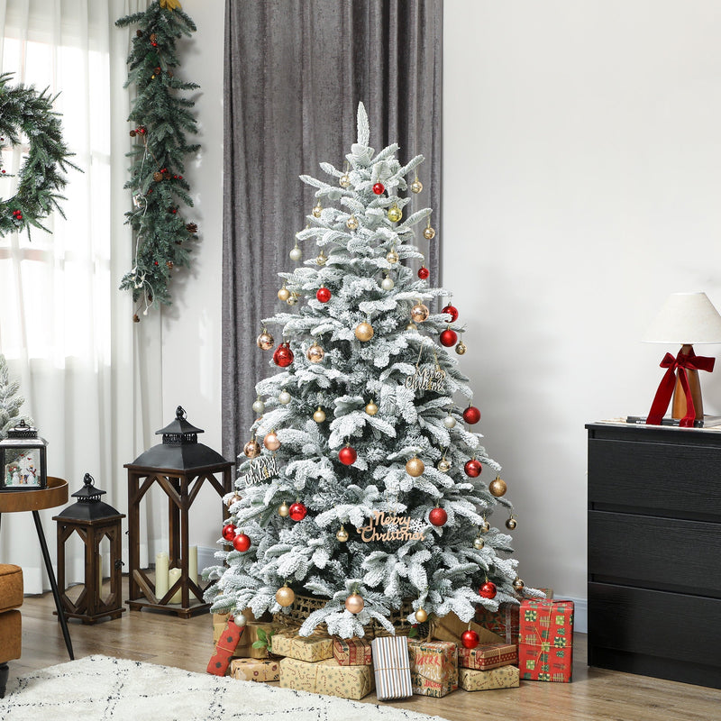 6ft snow flocked tree decorated with red and gold baubles in a living room with a wreath