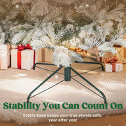 Dark green foldable metal base under the snow flocked branches