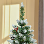 Close-up of the snow-tipped top of the tree with red berries and a pine cone