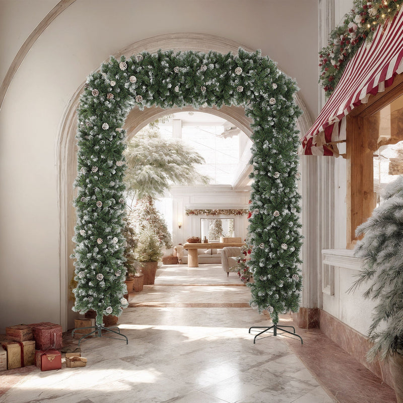 Frosted Christmas arch in a corridor beside a striped awning