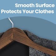 Close-up of smooth wood hanger surface protecting a garment from marks