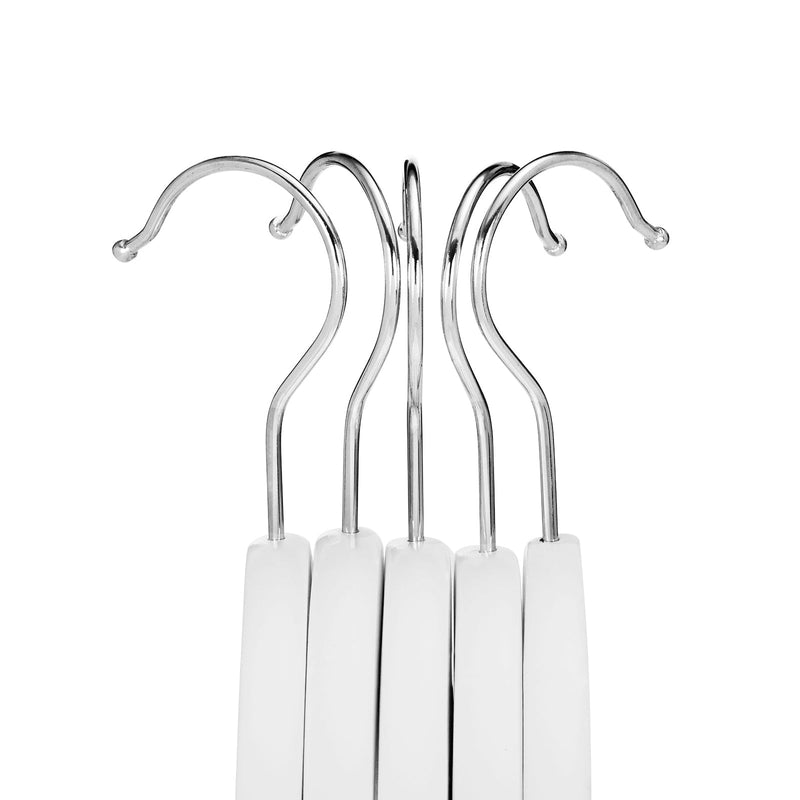 Close-up of the chrome hooks on five white wooden clothes hangers