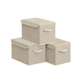 Three Songmics sand beige fabric storage boxes with lids stacked together