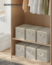 Sand beige storage boxes styled on a wardrobe shelf