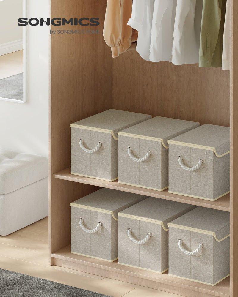 Sand beige storage boxes styled on a wardrobe shelf