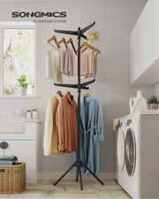 Black clothes airer styled in a laundry room with towels and a robe drying