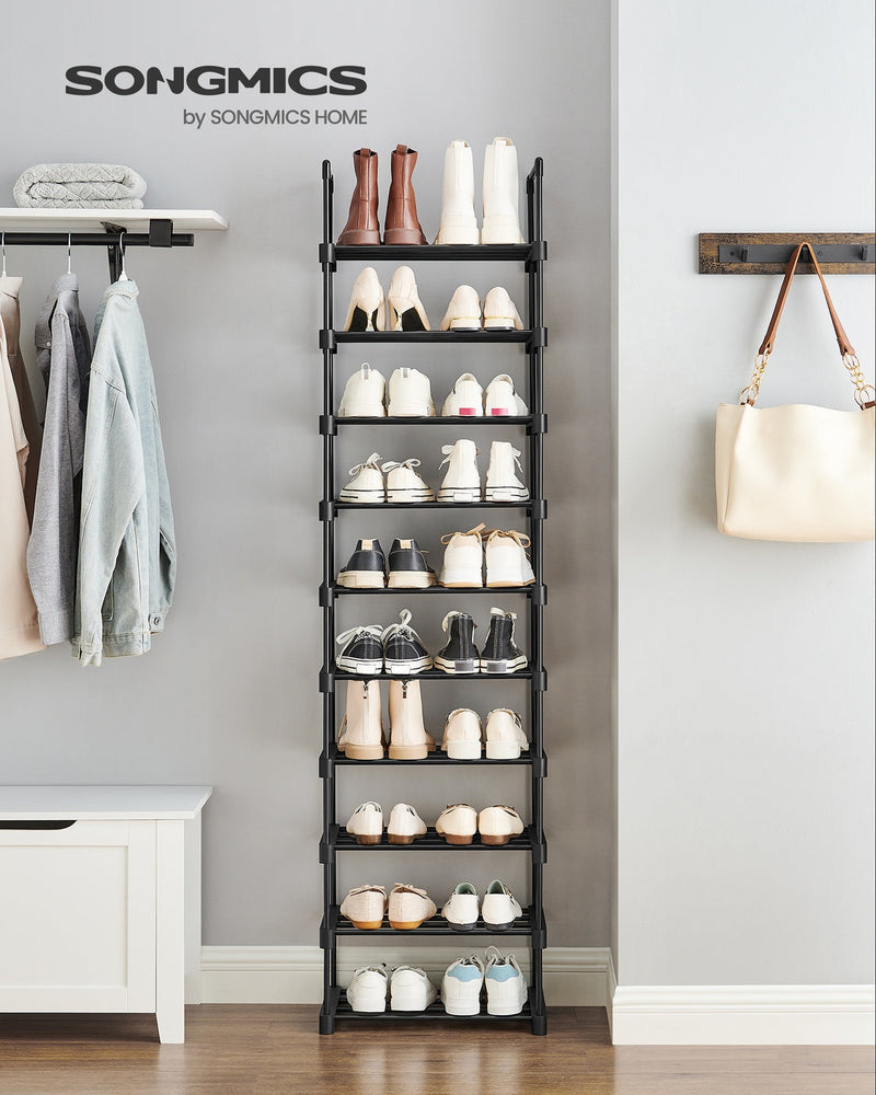 Black shoe rack styled in an entryway holding shoes and boots