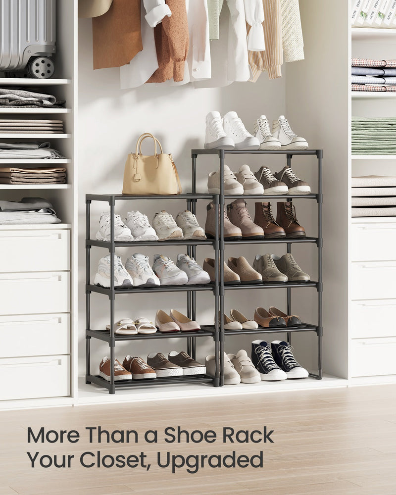 Two black shoe racks styled in a walk-in closet full of shoes