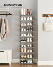Grey shoe rack styled in an entryway holding shoes and boots