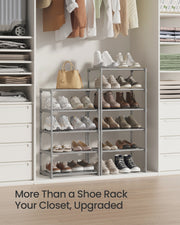 Two grey shoe racks styled in a walk-in closet full of shoes