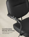 Image of a Songmics black leather office chair with wheels and arms