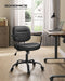 Image of a Songmics black leather office chair with wheels and arms