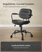Image of a Songmics black leather office chair with wheels and arms