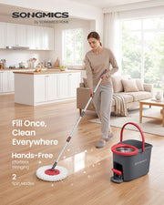 Woman mopping a wooden kitchen floor hands-free with the Songmics pedal spin mop