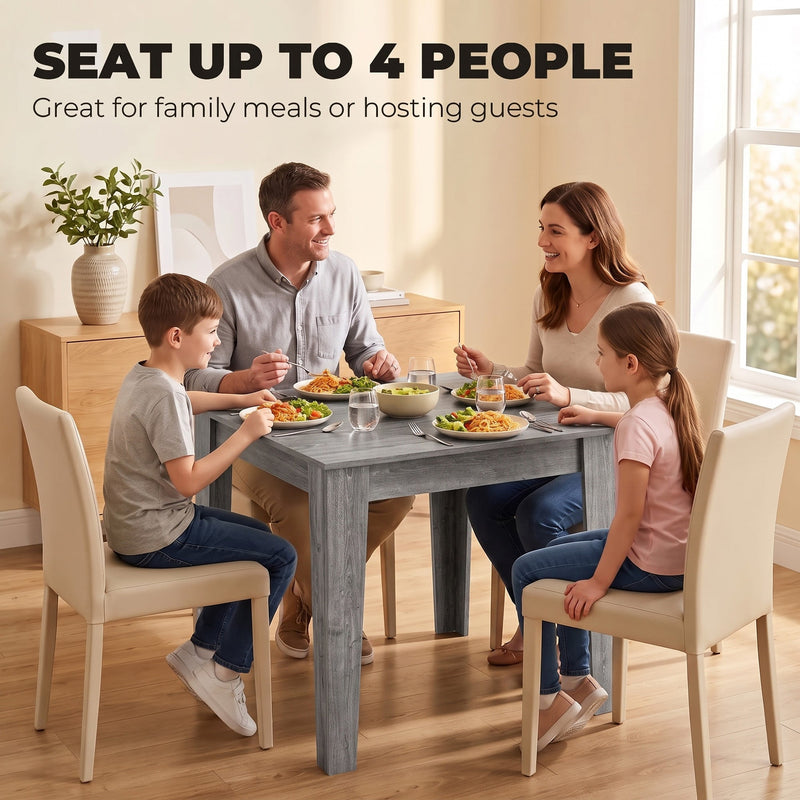 Family of four eating together around the grey dining table