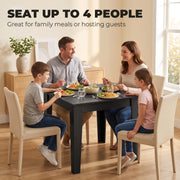 Family of four eating a meal at the Black Wood Effect dining table