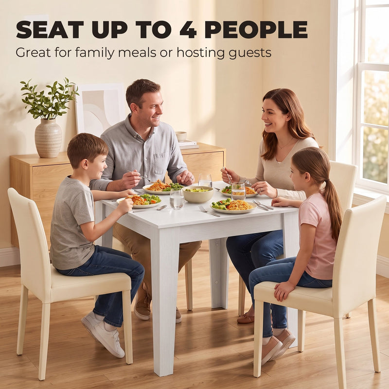 Family of four eating a meal at the white dining table