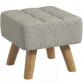Light brown linen-look footstool with tufted top and oak-tone wooden legs