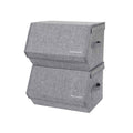 Two grey fabric storage boxes stacked with their hinged lids closed