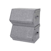 Two grey fabric storage boxes stacked with their hinged lids closed