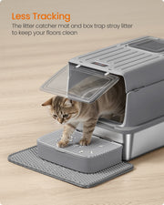 Cat stepping onto the litter catcher mat while exiting the stainless steel litter box, reducing litter tracking