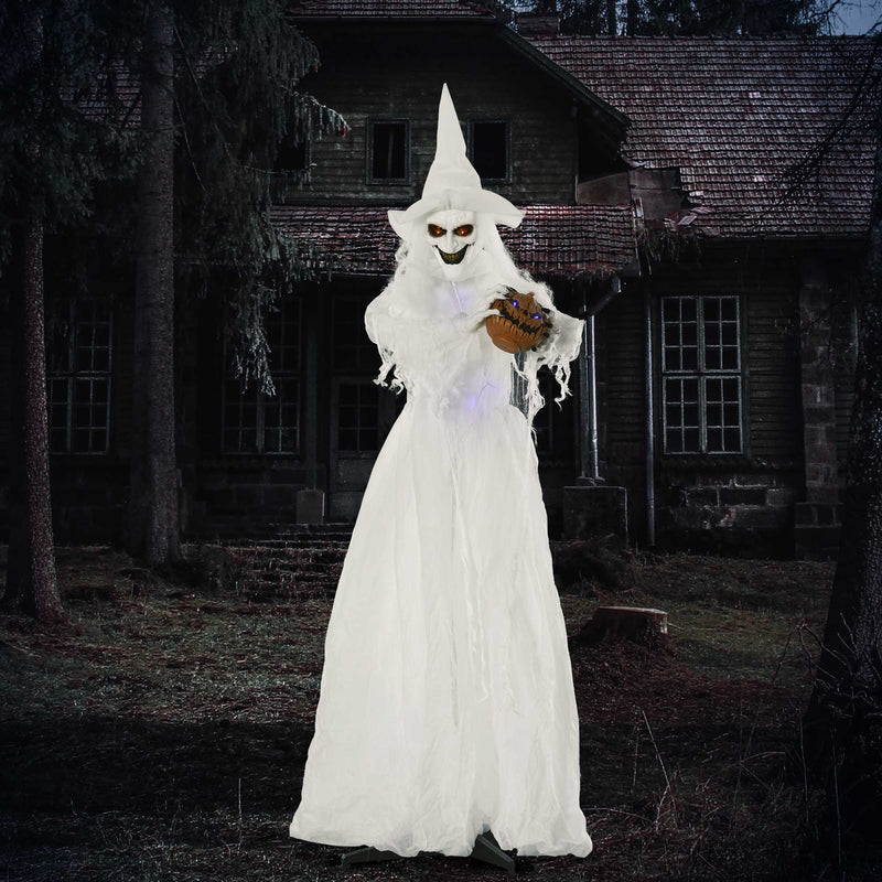 White standing witch lit up at night outside a derelict house