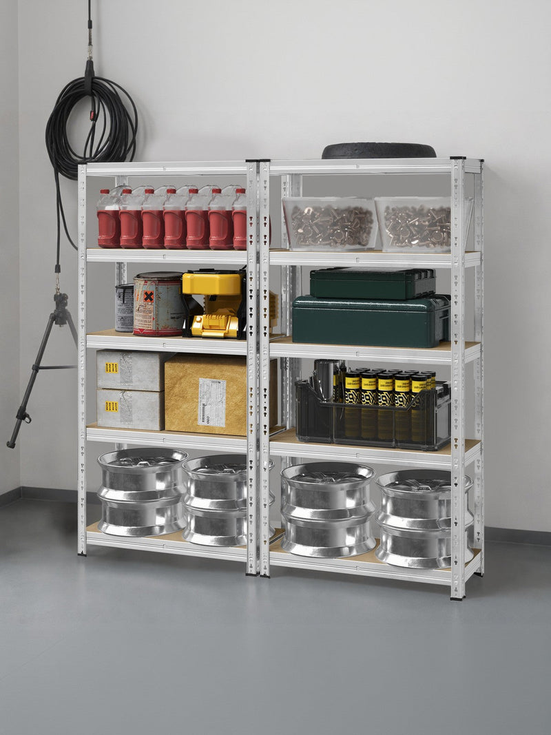 Silver shelving units storing car parts in a garage beside a coiled hose