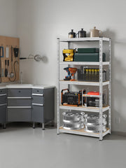 Shelving unit in a utility room next to a grey sink cabinet, holding tools