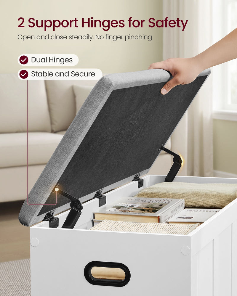 Hand lifting the bench lid, held steady by 2 safety hinges