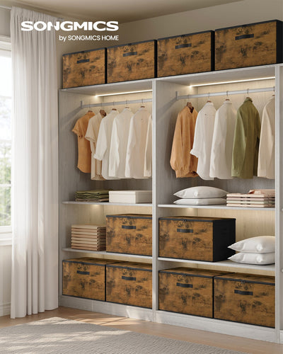 Rustic brown Songmics storage boxes styled on wardrobe shelves next to hanging clothes