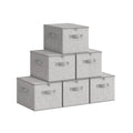 Set of 6 dove grey fabric storage boxes stacked in a pyramid arrangement showing zipped lids and side handles