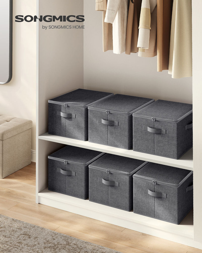 Six slate grey Songmics storage boxes with zipped lids arranged on wardrobe shelves