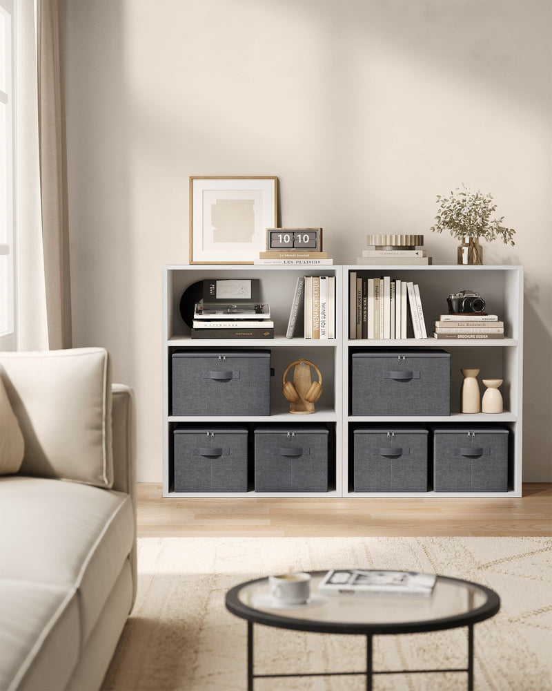 Songmics storage boxes fitted into a white cube bookcase in a living room