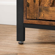 Close-up of a black steel leg with a levelling foot on a wooden floor
