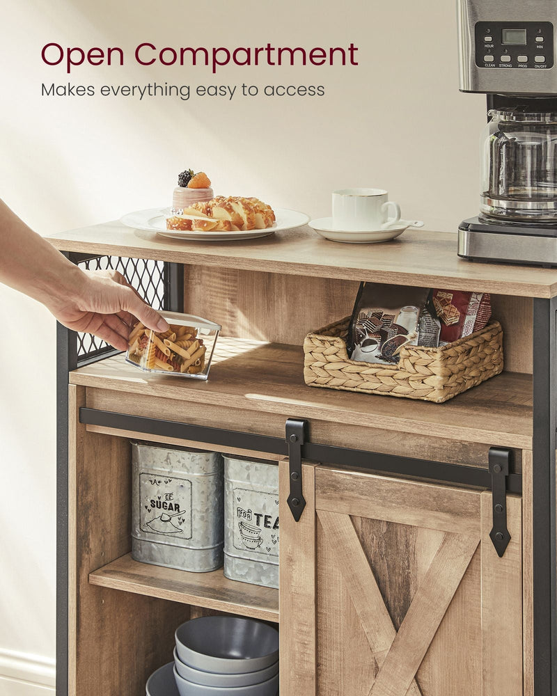 Close-up of the open top compartment with a hand reaching for a plate of pastries