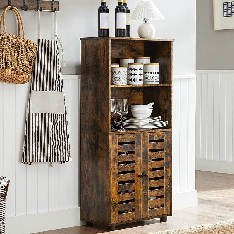 Rustic brown cabinet in a kitchen holding crockery, wine glasses and storage jars